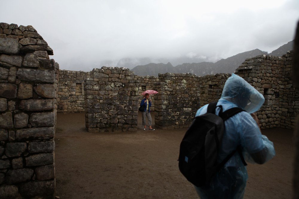 Some tourists were undeterred by the rain. Photo: Alex Washburn
