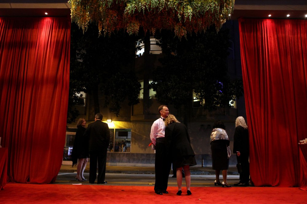 SFJazz Board Trustee Shona Brown and her husband John Rohrer wait for their vehicle as they leave the SF Jazz Gala in San Francisco Calif. on Friday, May 16, 2014. This year's gala  honored Herbie Hancock, a 14-time Grammy winner. (Photo Copyright The San Francisco Chronicle)