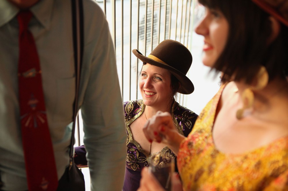Abbie Dwelle of Paul's Hatworks (center) makes her way up the stairs with Wendy Hawkins (right) and several other friends during the SF Jazz Gala in San Francisco Calif. on Friday, May 16, 2014. (Photo Copyright The San Francisco Chronicle)